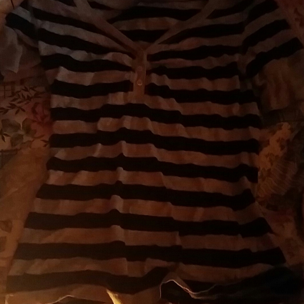 It a striped black and white T shirt